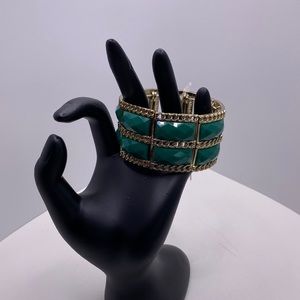 Cuff Bracelet with green glass beads.